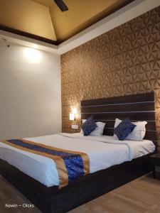 Postel nebo postele na pokoji v ubytování Redfox Hotel- Aminjikarai