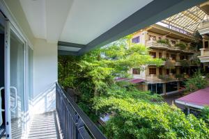 an external view of a balcony of a building at 1 BR Serviced Apt In The Heart of Siem Reap in Siem Reap