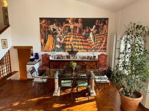 a living room with a large tapestry on the wall at VILLA TARA in Quercianella