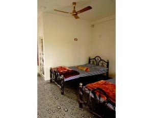 Llit o llits en una habitació de Royal Sundarban Resort, Pakhiralay, WB