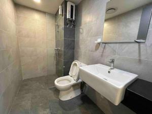 a bathroom with a white toilet and a sink at E2 Emporis KD Sunway Gize SOHO in Petaling Jaya