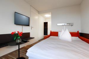 Voodi või voodid majutusasutuse Hotel Thurgauerhof Self-Check-in toas