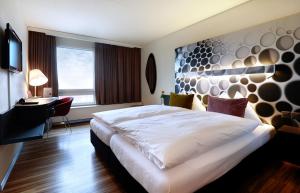 Voodi või voodid majutusasutuse Hotel Thurgauerhof Self-Check-in toas