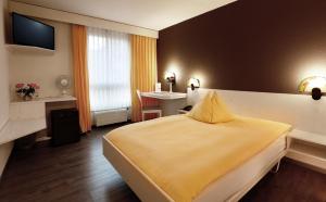 Voodi või voodid majutusasutuse Hotel Thurgauerhof Self-Check-in toas