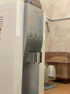 a remote control in a refrigerator in a kitchen at IPOH LYL EVERGREEN HOMESTAY 12pax in Ipoh +16 photos