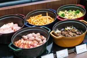 a buffet of different types of food in buckets at Shibuya Excel Hotel Tokyu in Tokyo