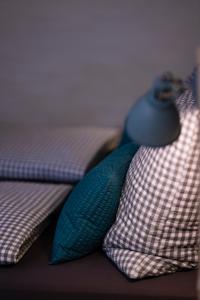 a blue tie sitting on top of some pillows at Stadtplatz23 B&B in Bogen