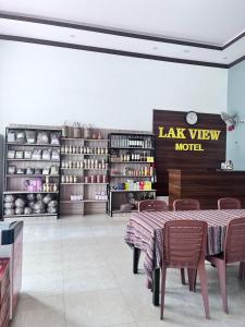 a restaurant with a table and chairs in a store at Lak View hotel in Lien Son