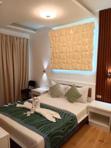 Krevet ili kreveti u jedinici u okviru objekta Pipa de Playa Resort Café