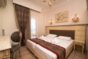 Postel nebo postele na pokoji v ubytování Parthenon Art Hotel + 37 fotografií