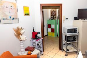 Televízia a/alebo spoločenská miestnosť v ubytovaní Residenza Coccinelle vista Lago d'Iseo
