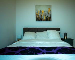 Ein Bett oder Betten in einem Zimmer der Unterkunft Skyview Luxury appartement à Montevrain