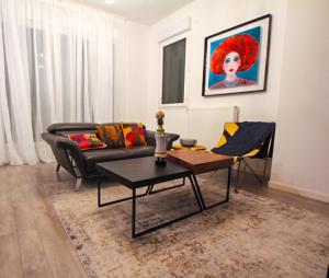 Ein Sitzbereich in der Unterkunft Skyview Luxury appartement à Montevrain