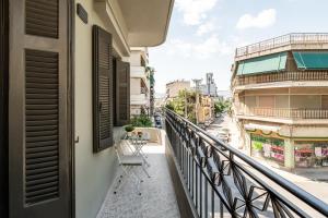 a balcony with a view of a street at Ranny House in Athens