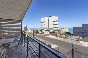 a balcony of a building with a view of a street at Manhattan on Coral 7 in Bloubergstrand