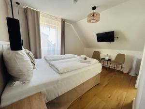 Postel nebo postele na pokoji v ubytování STRANDHUUS Norddeich