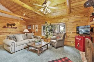 a living room with a couch and chairs and a tv at 2417-Timber Pines Chalet cabin in Big Bear Lake