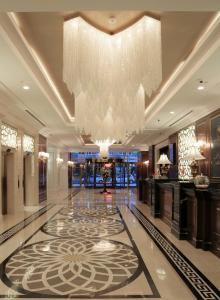 a large lobby with a large chandelier and a floor at Latanya Hotel Ankara in Ankara