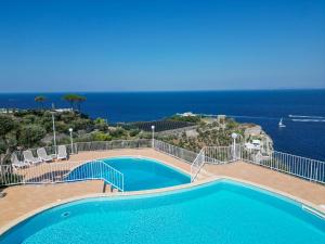 a swimming pool with a view of the ocean at Hotel Villa Lubrense Sorrento in Massa Lubrense