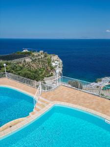 a swimming pool with a view of the ocean at Hotel Villa Lubrense Sorrento in Massa Lubrense