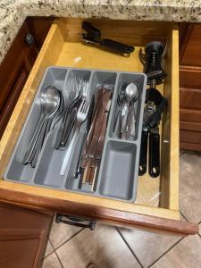 a tray with utensils in a drawer in a kitchen at Cozy Guest Home close UBC and Downtown in Vancouver