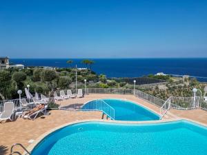 a swimming pool with a view of the ocean at Hotel Villa Lubrense Sorrento in Massa Lubrense