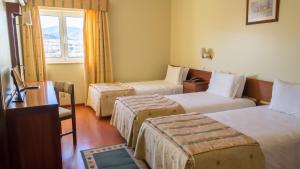 Cama ou camas em um quarto em Hotel Belsol