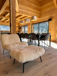 a dining room with chairs and a dining table at Chalet ECRIN DES VIGNES in Les Vigneaux