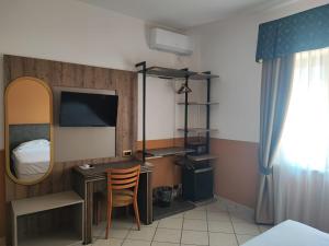 Postel nebo postele na pokoji v ubytování Hotel Al Faro