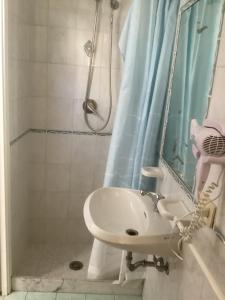 a bathroom with a sink and a shower at Capricornio Club Diffuso in Maiori +12 photos