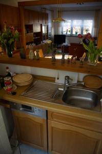 a kitchen with a sink and a counter top at Kernberg Apartment Jena in Jena