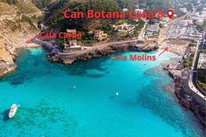 an aerial view of a beach with boats in the water at Can Botana Casa 8 - By Dream Villas Pollensa in Cala de Sant Vicenc
