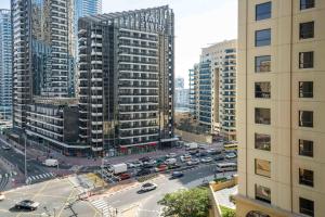 an aerial view of a city with tall buildings at LUXFolio Retreats - Spacious 3 Bed - Marina Living in Dubai