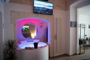 TV a/nebo společenská místnost v ubytování La Dimora di Venere