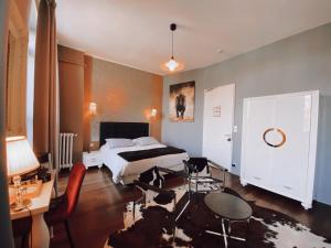 Un ou plusieurs lits dans un hébergement de l'établissement Royal Hôtel