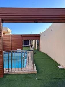 a balcony of a building with a swimming pool at استراحة وشاليه وقاعة السلطانه in Al-Salam