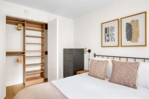 a bedroom with a bed and a closet at Midtown E 2br w elevator doorman gym nr UN NYC-752 in New York