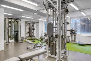 a gym with tread machines and a green floor at Midtown E 2br w elevator doorman gym nr UN NYC-752 in New York