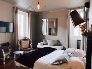 Un ou plusieurs lits dans un hébergement de l'établissement Royal Hôtel