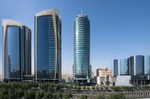 a group of tall buildings in a city at Hilton Riyadh Olaya in Riyadh