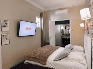 Un ou plusieurs lits dans un hébergement de l'établissement Royal Hôtel