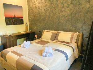 Postel nebo postele na pokoji v ubytování B&B Agriturismo 'A Cunziria