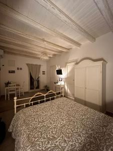 a bedroom with a large bed in a room at Loft Ballarò in Palermo
