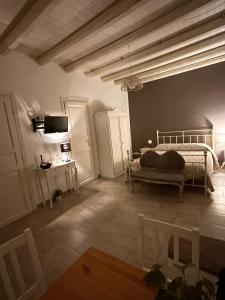 a bedroom with a bed and a table and chairs at Loft Ballarò in Palermo