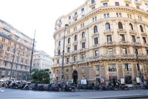 a large building with motorcycles parked in front of it at Da Francesco in Naples