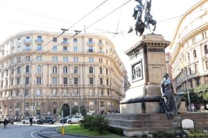 a statue in front of a building with buildings at Da Francesco in Naples