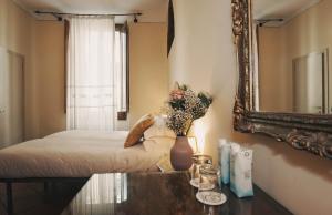 Postel nebo postele na pokoji v ubytování Hotel Galileo