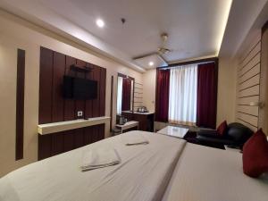 Televiisor ja/või meelelahutuskeskus majutusasutuses New Gitanjali Hotel, New Digha