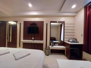 Voodi või voodid majutusasutuse New Gitanjali Hotel, New Digha toas