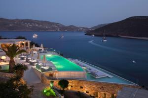a view of a body of water with a large pool at Panormos Village Hotel in Mykonos